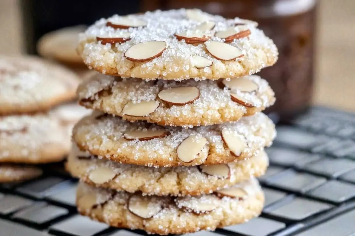 Easy 30-Minute Italian Almond Sugar Cookies Italian Almond Sugar Cookies A batch of Italian Almond Sugar Cookies dusted with powdered sugar and arranged on a rustic wooden table in warm natural light.