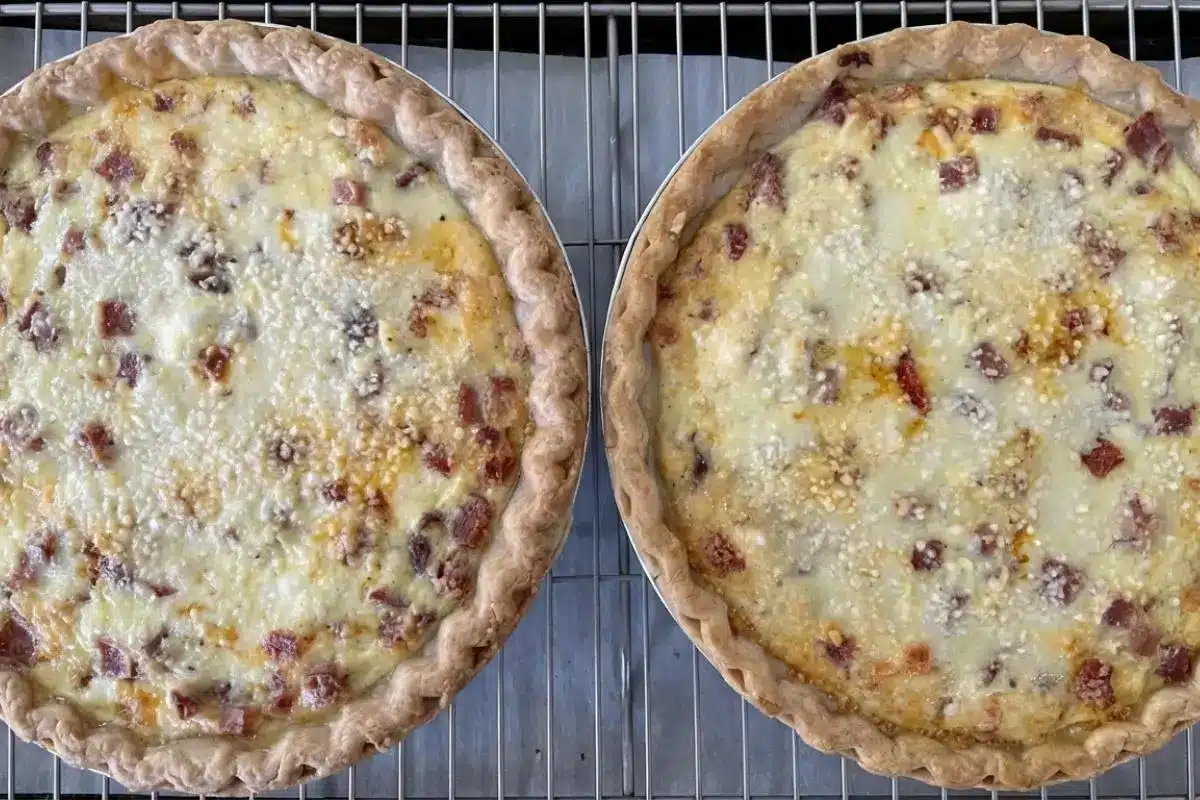 How to Make Italian Easter Pie Step-by-Step Two freshly baked, open-faced savory pies resting on a wire cooling rack, showcasing the delicious final result of how to make Italian Easter Pie step-by-step.