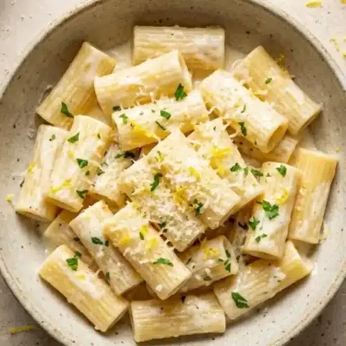 Nonna’s 15-Minute Creamy Lemon Pasta (A Foolproof Weeknight Lifesaver) Creamy Lemon Pasta A rustic ceramic bowl filled with comforting lemon ricotta pasta, beautifully garnished with fresh lemon zest, parsley, and finely grated cheese.