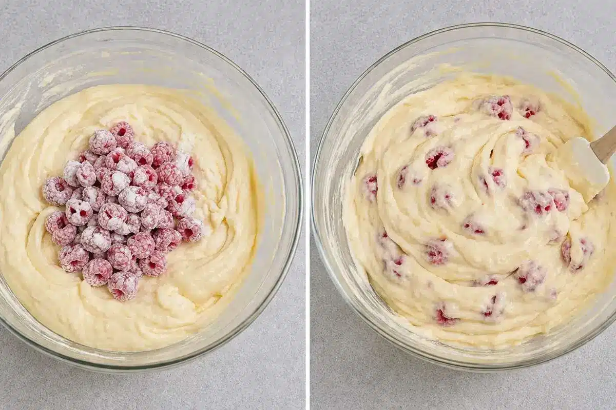white-chocolate-raspberry-cake-folding-raspberries Fresh raspberries being gently folded into white chocolate raspberry cake batter in a glass bowl, creating a thick and creamy mixture.